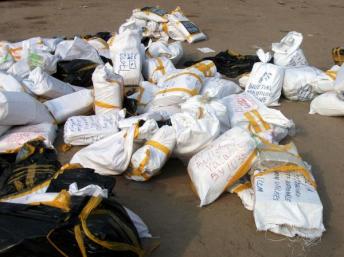 Packets of ballot papers lying on the floor at the Fikin International compilation centre in Kinshasa