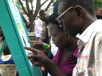 Voters searching for their names on the voter list in Matete, Kinshasa