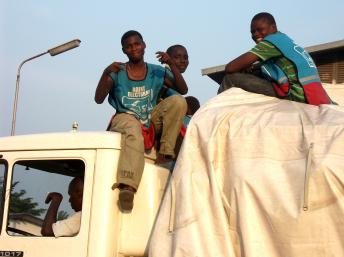 Electoral commission workers sitting atop a truck entering the Fikin counting centre, Kinshasa, 30 November